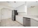 White cabinets and stainless steel appliances in kitchen at 664 Silk Oak Dr, Venice, FL 34293