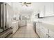 Kitchen with stainless steel appliances and white cabinets at 664 Silk Oak Dr, Venice, FL 34293