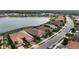 Aerial view showcasing home's location near lake at 11684 Renaissance Blvd, Venice, FL 34293