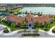 Community center with large pool and Spanish-style architecture at 11684 Renaissance Blvd, Venice, FL 34293