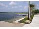 Serene waterfront access with a dock and walking path at 11684 Renaissance Blvd, Venice, FL 34293