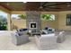 Relaxing outdoor lounge with fireplace and seating at 11684 Renaissance Blvd, Venice, FL 34293