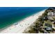 Beach with people, umbrellas, and a basketball court at 5885 Denison Dr, Venice, FL 34293