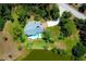 Bird's-eye view of home, pool, and waterfront lot at 5885 Denison Dr, Venice, FL 34293