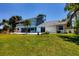 Two-story home with grassy backyard and pool at 5885 Denison Dr, Venice, FL 34293