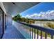 Private balcony overlooking the pool and lake at 5885 Denison Dr, Venice, FL 34293