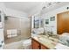 Bathroom with tub/shower combo and granite countertop at 5885 Denison Dr, Venice, FL 34293