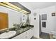Clean bathroom with granite vanity and updated fixtures at 5885 Denison Dr, Venice, FL 34293