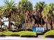Venice Beach access with palm trees and signage at 5885 Denison Dr, Venice, FL 34293