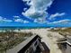 Steps leading to a sandy beach at 5885 Denison Dr, Venice, FL 34293