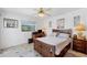 Guest bedroom with a full-size bed and dresser at 5885 Denison Dr, Venice, FL 34293