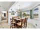 Bright dining area with lake view at 5885 Denison Dr, Venice, FL 34293