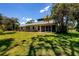 Single-Gathering home exterior with lush landscaping at 5885 Denison Dr, Venice, FL 34293