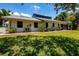 Ranch-style home with lush landscaping at 5885 Denison Dr, Venice, FL 34293