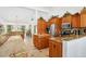 Open kitchen with granite island and breakfast bar at 5885 Denison Dr, Venice, FL 34293