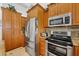 Kitchen with granite countertops and stainless steel appliances at 5885 Denison Dr, Venice, FL 34293