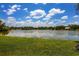 Serene view of a lake with lush greenery at 5885 Denison Dr, Venice, FL 34293