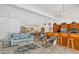 Open living space with light teal couch at 5885 Denison Dr, Venice, FL 34293