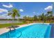 Large pool with a stunning lake view at 5885 Denison Dr, Venice, FL 34293
