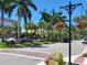 Scenic street lined with palm trees and flowers at 5885 Denison Dr, Venice, FL 34293