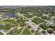 Aerial view of community with lake and homes at 139 Kings Dr, Rotonda West, FL 33947