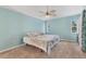 Light and airy bedroom with carpet flooring at 139 Kings Dr, Rotonda West, FL 33947