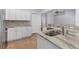 Modern kitchen with granite countertops and white cabinets at 139 Kings Dr, Rotonda West, FL 33947