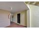 Private condo entry hallway with neutral walls and flooring at 626 Bird Bay S Dr # 106, Venice, FL 34285