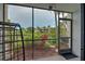 Relaxing screened patio overlooking a tranquil pond and lush landscaping at 626 Bird Bay S Dr # 106, Venice, FL 34285