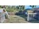 Partially fenced backyard with chicken coop at 3781 Wayward Ave, North Port, FL 34286