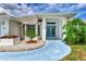 White house with blue door and walkway, landscaping, and a bright sunny day at 5888 Garfield Rd, Venice, FL 34293