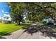 Tree-lined street with single story homes at 1840 Vera Pl # 81, Sarasota, FL 34235