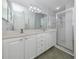 Bathroom features a double vanity and a walk-in shower at 501 Ravinia Cir # 501, Venice, FL 34292