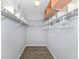 Large walk-in closet with wire shelving and hanging rods at 501 Ravinia Cir # 501, Venice, FL 34292