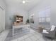 Virtually staged home office features built-in shelving and hardwood floors at 501 Ravinia Cir # 501, Venice, FL 34292