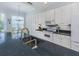 Modern kitchen with granite countertops and white cabinets at 501 Ravinia Cir # 501, Venice, FL 34292