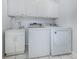 Laundry room with washer, dryer, and utility sink at 501 Ravinia Cir # 501, Venice, FL 34292