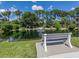 Serene pond with fountain and bench for relaxation at 501 Ravinia Cir # 501, Venice, FL 34292