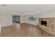 Bright living room with fireplace and sliding glass doors leading to a patio at 1411 Strada D Argento, Venice, FL 34292