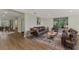 Living room with leather sofas and a rustic coffee table at 1411 Strada D Argento, Venice, FL 34292