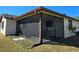 Outdoor screened porch area with a view of the backyard at 1411 Strada D Argento, Venice, FL 34292