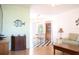 Open floor plan with laminate flooring and a view into the dining area at 221 Malvern Dr, Venice, FL 34293
