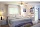Cozy bedroom with a ceiling fan and a coastal theme at 221 Malvern Dr, Venice, FL 34293