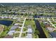 Aerial view showing home's location on canal with a pool at 9 Bunker Ln, Rotonda West, FL 33947