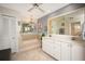 Spa-like bathroom featuring a soaking tub, double vanity, and shower at 9 Bunker Ln, Rotonda West, FL 33947