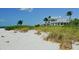 Beachfront home with white exterior, and palm trees at 9 Bunker Ln, Rotonda West, FL 33947