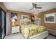 Charming bedroom with a queen-size bed and access to patio at 9 Bunker Ln, Rotonda West, FL 33947