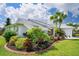 Beautiful landscaping highlights this home's curb appeal at 9 Bunker Ln, Rotonda West, FL 33947