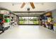 Organized garage with storage and view of backyard at 9 Bunker Ln, Rotonda West, FL 33947