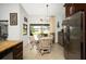 Kitchen nook with a view of the pool and patio, featuring stainless steel appliances at 9 Bunker Ln, Rotonda West, FL 33947